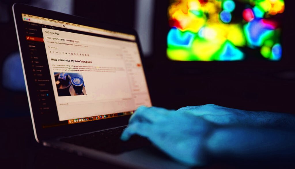 Person typing on a laptop with a blog post editor open, displaying the title'How I promote my new blog posts,' and a vibrant, colorful screen in the background.